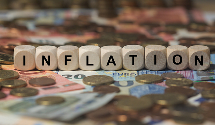 A picture of currency of the world with the word inflation above.