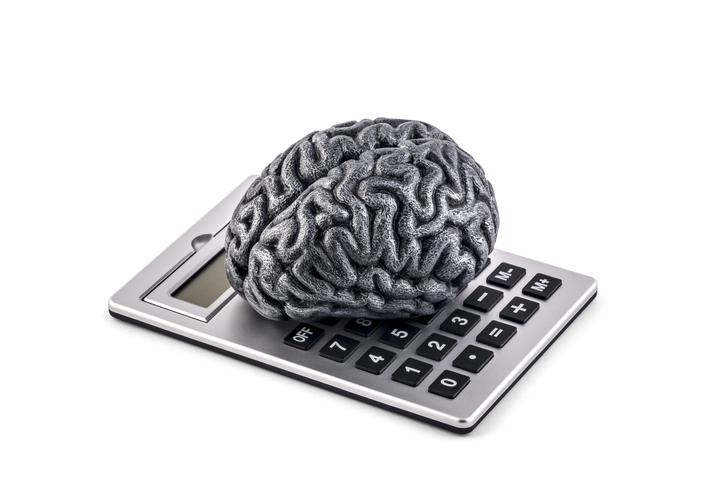 Picture of a brain on top of a calculator