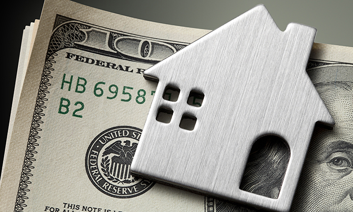 A picture of a house with a background of cash.