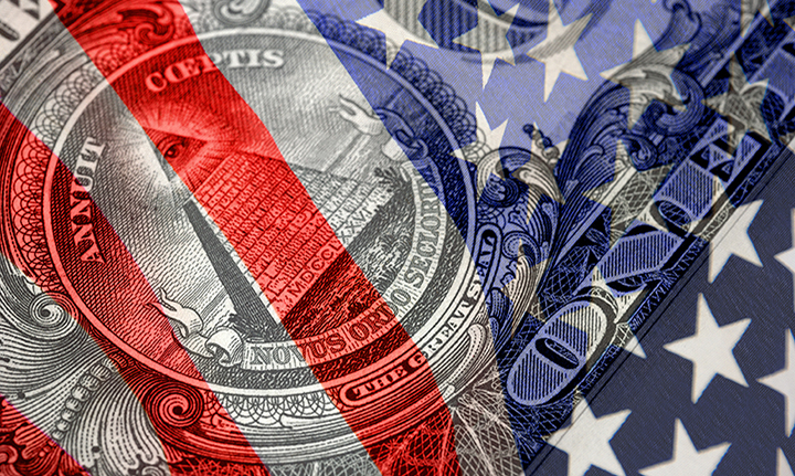 A picture of a one dollar bill with the US flag superimposed in the foreground.